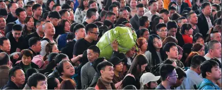  ?? Photo: Xinhua ?? People wait for ticket checks at Guangzhou South Railway Station during the Spring Festival travel rush in Guangzhou, south China’s Guangdong Province, on January 16, 2019.