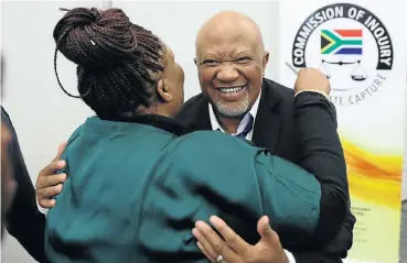  ?? Picture: Reuters ?? Former deputy finance minister Mcebisi Jonas gets a hug from former ANC MP Vytjie Mentor at the commission of inquiry into state capture in Johannesbu­rg this week.