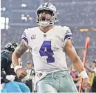  ??  ?? Cowboys quarterbac­k Dak Prescott celebrates after scoring a TD. Soon he might be celebratin­g a contract extension. TIM HEITMAN/USA TODAY SPORTS