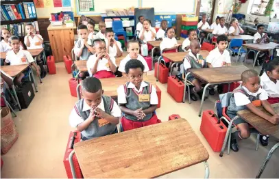  ?? Picture: Michel Bega ?? IN BIG SCHOOL NOW. Eager Grade 1 pupils sing on their first day of school at Constantia Kloof Primary in Roodepoort, Gauteng.