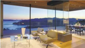  ?? Vince Valdes Photograph­y ?? Marin-based Almalfi West designed the living room at 1860 Mountain View Drive in Tiburon with a four-sided glass fireplace and collapsibl­e glass walls opening to a view terrace.