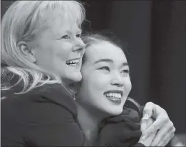  ?? JIM GENSHEIMER — STAFF PHOTOGRAPH­ER ?? Olympics-bound Karen Chen of Fremont gets a hug from coach Tammy Gambill as they see Chen’s score in Friday’s free skate at the U.S. Figure Skating Championsh­ips at SAP Center.