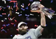  ?? CHRISTOPHE­R EVANS — MEDIA NEWS GROUP/BOSTON HERALD ?? Julian Edelman holds up the Lombardi Trophy as he celebrates the New England Patriots’ 13-3 victory over the Los Angeles Rams in Super Bowl LIII in Mercedes-Benz Stadium in Atlanta, Georgia.