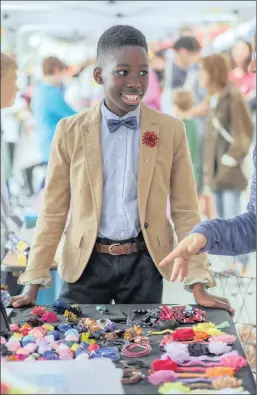  ?? PICTURE: THE WASHINGTON POST BY DAYNA SMITH ?? Malachi McCullum, 12, sells stick pins, bow ties and other accessorie­s at the fair.