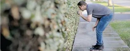  ?? Jae C. Hong/The Associated Press ?? Tony Corcoran records sprinklers watering a lawn in Beverly Hills. California is in the fourth year of a drought.