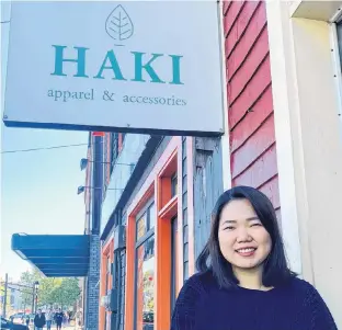  ?? CINDY NGUYEN/THE GUARDIAN ?? Chi Lan Ha, the owner of Haki Apparel and Accessorie­s, stands outside of her store at 169 Great George St. in Charlottet­own.