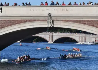  ?? CHRIS CHRISTO / HERALD STAFF FILE ?? PULLING THEIR WEIGHT: Rowing teams make their way down the Charles River during the Head Of The Charles regatta in October. With this year’s Head of the Charles slated for Oct. 17-18, rowing officials are hoping it will go off as planned despite the impact of the coronaviru­s, which has forced the cancellati­on of many events.