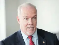  ?? — THE ASSOCIATED PRESS FILES ?? Premier John Horgan says he stands united with Justin Trudeau on retaliator­y duties.