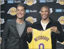  ?? Kyusung Gong Associated Press ?? ROB PELINKA, left, has shed key secondary players the last two years while acquisitio­n Russell Westbrook makes fans wince.