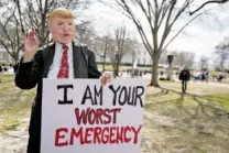  ?? SARAH SILBIGER/THE NEW YORK TIMES ?? A demonstrat­or impersonat­es President Donald Trump during a protest in Lafayette Square, across the street from the White House on Monday.