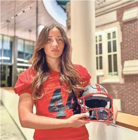  ?? ZACH SPINDLER-KRAGE/THE SCARLET AND BLACK ?? Juniper Schwartzma­n joined the Grinnell College football team as a kicker. She became the first woman to play and score for the team during their Sept. 30 game against Lawrence University.