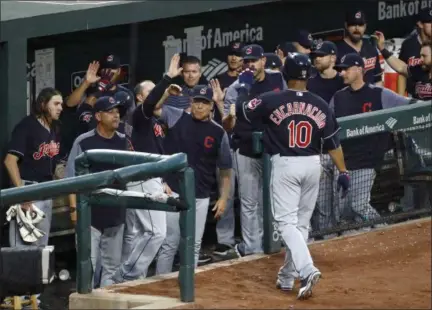  ?? PATRICK SEMANSKY — ASSOCIATED PRESS ?? Teammates greet Edwin Encarnacio­n after he scored on a single by Austin Jackson during the third inning against the Orioles on June 22 in Baltimore.