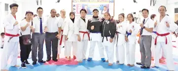  ??  ?? Simon (second right) with some of the SKAS officials and athletes who took part in the 5th Shito Ryu Sabah Inter-Dojo Tournament. SKAS concluded in fourth place overall with five gold, two silver and 10 bronze medals.