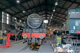  ?? ?? Inside Bridgnorth shed on October 24 are BR Standard 4MT 4-6-0 No. 75069, LMS 4-6-0 No. 46100 Royal Scot and Dunrobin. The original brick goods shed, now a machine shop, is in the background.