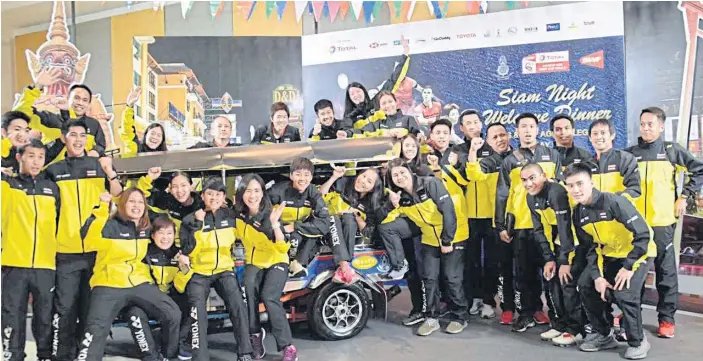  ??  ?? Thai players and officials pose during a reception ahead of the Thomas Cup and Uber Cup finals which begin today.