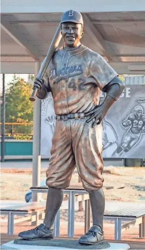  ?? MEL GREGORY/AP ?? –
This statue of baseball legend Jackie Robinson was stolen and destroyed in Wichita, Kansas.