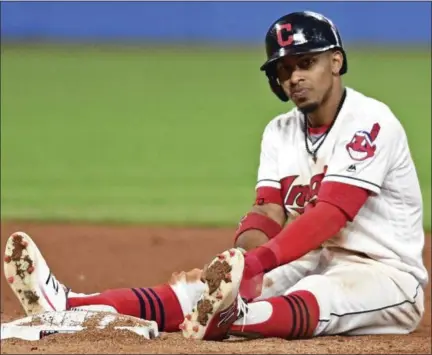  ?? DAVID DERMER; THE ASSOCIATED PRESS ?? Cleveland Indians’ Francisco Lindor sits near second base after being forced out in a double play in the seventh inning of a baseball game against the Kansas City Royals, on Friday, September 15in Cleveland.