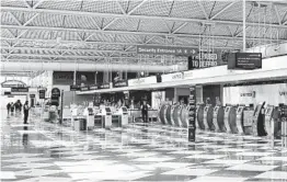  ?? TERESA CRAWFORD AP ?? The lockdown last year meant check-in counters such as this one at Chicago's O'hare Internatio­nal Airport were empty. Now airports are filling up again.