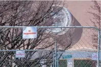  ?? EDDIE MOORE/JOURNAL ?? The Roundhouse has been fenced off during the 2021 legislativ­e session, and signs warn pedestrian­s against trespassin­g. But the lack of access hasn’t stopped lobbyists from finding ways to feed lawmakers and cover the cost of their meals.