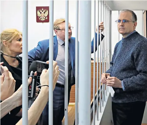  ??  ?? Paul Whelan, a security specialist for an auto parts company, stands in a defendants’ cage in Moscow, facing charges for allegedly possessing documents that contain state secrets