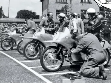  ??  ?? LEFT The NSU team looking formidable prior to the start of the 1954 Isle of Man Lightweigh­t TT; 7 Werner Haas (winner), 24 Hermann Muller (4th), 30 Reg Armstrong (3rd), 15 Rupert Hollaus (2nd).