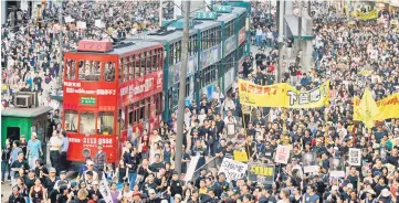  ?? — AFP photo ?? File photo shows trams sit stranded as thousands of people block the streets during a protest against a controvers­ial anti-subversion law known as Article 23 in Hong Kong.
