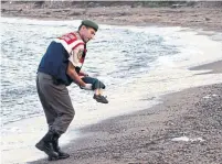  ?? THE ASSOCIATED PRESS ?? The heart-rending photo of 3-year-old Alan Kurdi’s lifeless body appeared in newspapers around the world on Sept. 3, 2015.