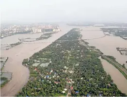  ?? — PTI ?? An aeriel view of the floods in Aluva after heavy rains in Kerala on Friday.