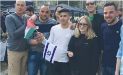  ?? (Adam Rasgon) ?? PEOPLE POSE for a photo at the Minds of Peace event in Tel Aviv on Friday.