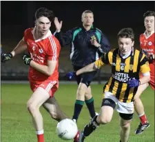  ??  ?? The ball moves away from Conor Hughes (Ballinastr­agh Gaels) and Hugh Peter Manley (Shelmalier­s).