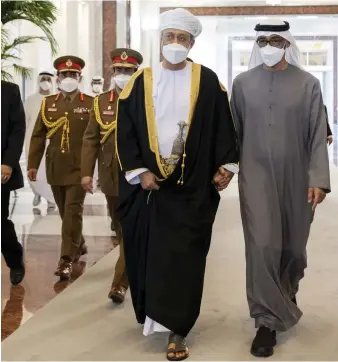  ?? Rashed Al Mansoori / Ministry of Presidenti­al ?? Sultan Haitham of Oman walks with the President, Sheikh Mohamed, after arriving at the Presidenti­al Airport in Abu Dhabi to offer his condolence­s