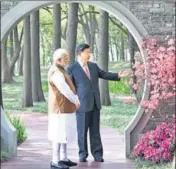  ?? AP ?? PM Narendra Modi with Chinese President Xi Jinping at a garden in Wuhan in China's Hubei Province on Saturday.