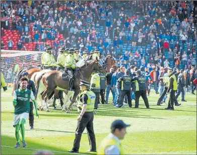  ??  ?? Supporters ran onto the Hampden Park pitch after last year’s Scottish Cup final betweeen Rangers and HIbs