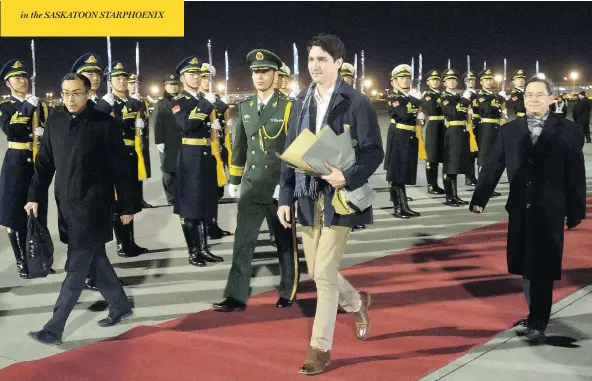  ?? SEAN KILPATRICK / THE CANADIAN PRESS ?? Prime Minister Justin Trudeau arrives in Beijing on Sunday as speculatio­n mounts about free trade talks between China and Canada.