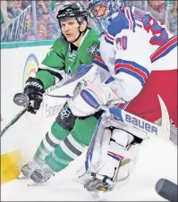  ??  ?? DENIAL: Henrik Lundqvist, who made 27 saves, keeps the puck away from the Stars’ Antoine Roussel.