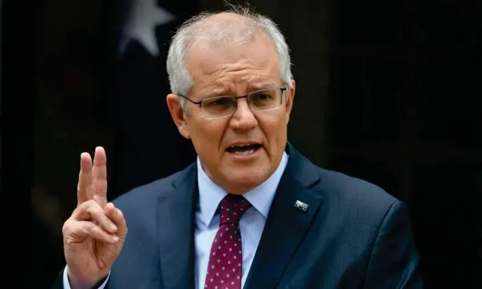  ?? Photograph: Mick Tsikas/AAP ?? Scott Morrison says the federal government is ‘meeting our responsibi­lities’ and has brought forward the national cabinet meeting to Thursday.