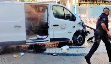  ??  ?? Deadly weapon: The terrorist’s rented transit van after crashing into a tourist kiosk