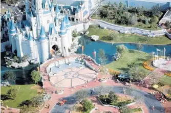  ?? ORLANDO SENTINEL FILE ?? The area in front of Cinderella Castle is all shiny and new for the Opening Day of Walt Disney World.