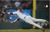  ?? Thearon W. Henderson
/ Getty Images /TNS ?? Los Angeles Dodgers third baseman Justinturn­er dives but fails to deny a double by the San Francisco Giants’ Mauricio Dubon in the fourth inning at Oracle Park on Sept. 4 in San Francisco.the Dodgers tied the Giants for first place in the NL West with a 6-1 win.