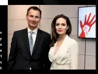  ??  ?? Right: Foreign Secretary Jeremy Hunt with Angelina last week. Left: she leaves the BFI after the film festival launch