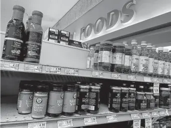  ?? Justin Sullivan/Getty Images ?? A store shelf sits empty where bottles of Huy Fong Foods sriracha sauce are usually displayed on June 10 in San Anselmo, Calif. Fans of the sauce are clearing aisles and rationing their stash.