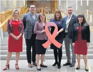  ??  ?? Support Clare Haughey MSP, right, with HIV Scotland representa­tives and fellow parliament­arians