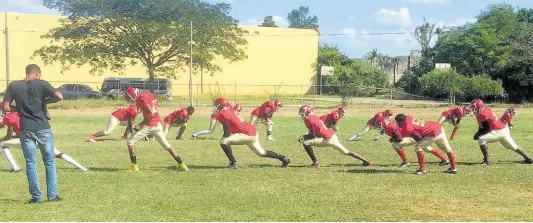  ?? FILE ?? Newell High School’s tackle football players engage in warm-up drills ahead of the National Gridiron Championsh­ip game against Munro College at the UWI Mona Bowl on Saturday, February 1, 2020.