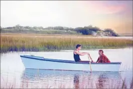  ?? Dana Hawley ?? OF A SCENE involving actors Walker and Palmer, Sparks asks, “Is there anything more romantic than a sunset boat ride?” The author counts North Carolina’s mountains, farmland, rivers and coastline among its attraction­s.