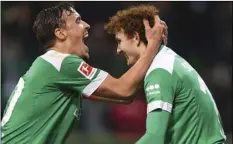  ??  ?? Werder Bremen’s Josh Sargent (right) celebrates with Max Kruse after scoring a goal against Fortuna Duesseldor­f during a Bundesliga soccer match, on Friday, in Bremen, Germany. CARMEN JASPERSEN/DPA VIA AP