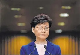  ?? Vincent Yu The Associated Press ?? Hong Kong Chief Executive Carrie Lam pauses during a press conference Tuesday in Hong Kong. Lam said the effort to amend an unpopular bill that would allow criminal suspects to be extradited to mainland China was dead.