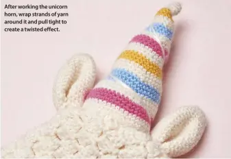  ??  ?? After working the unicorn horn, wrap strands of yarn around it and pull tight to create a twisted effect.