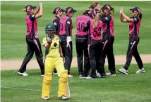  ?? PHOTO: GETTY IMAGES ?? The New Zealand women’s team celebrates the wicket of Ashleigh Gardner during their series-clinching win over Australia in Adelaide.