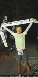  ?? Photo by Judyth Greenburgh ?? Yoshihiko Ishikawa poses with the finish line as the 2022 men’s champion Badwater 135 Ultramarat­hon winner.