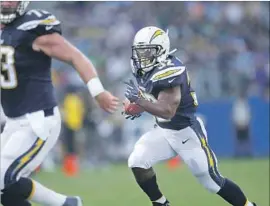  ?? K.C. Alfred San Diego Union-Tribune ?? BRANDEN OLIVER, running against Seattle at StubHub Center on Sunday, was the Chargers’ leading rusher as a rookie in 2014. Injuries have slowed him since.